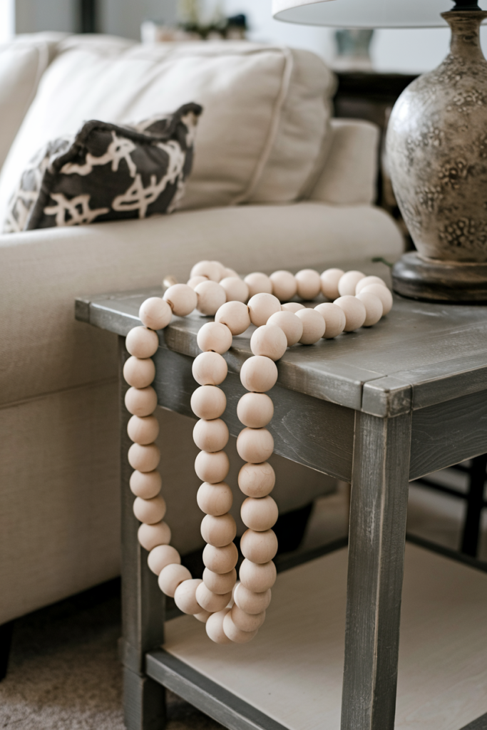 End table decorated with wooden bead garland