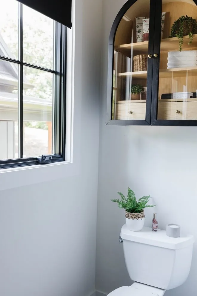 Elegant Glass Display Box Above the Toilet