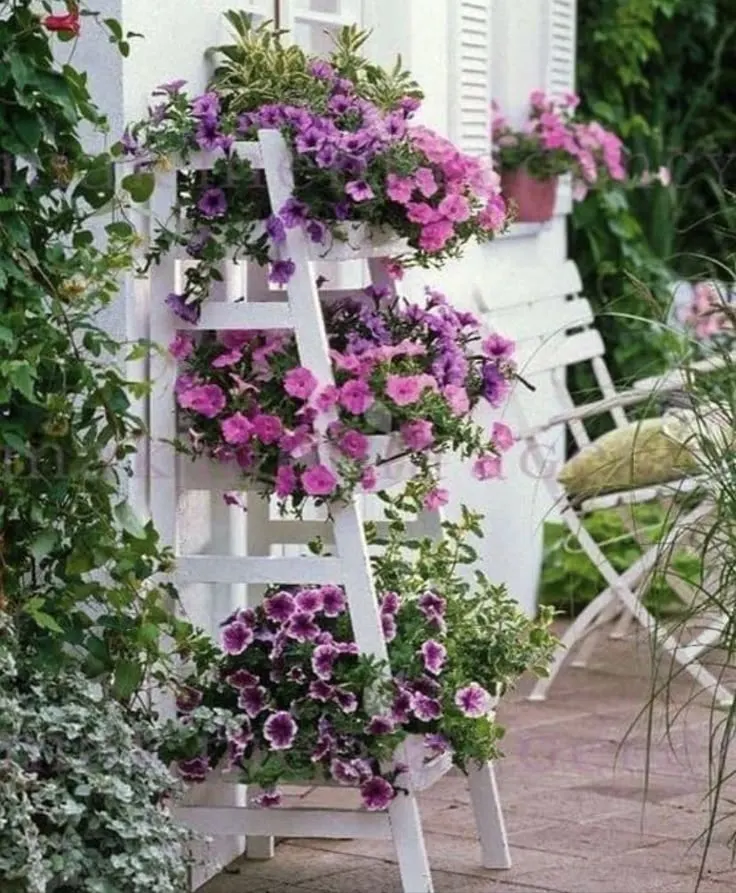 Repurposed Wooden Ladder Plant Stand as a Spring Porch Decor