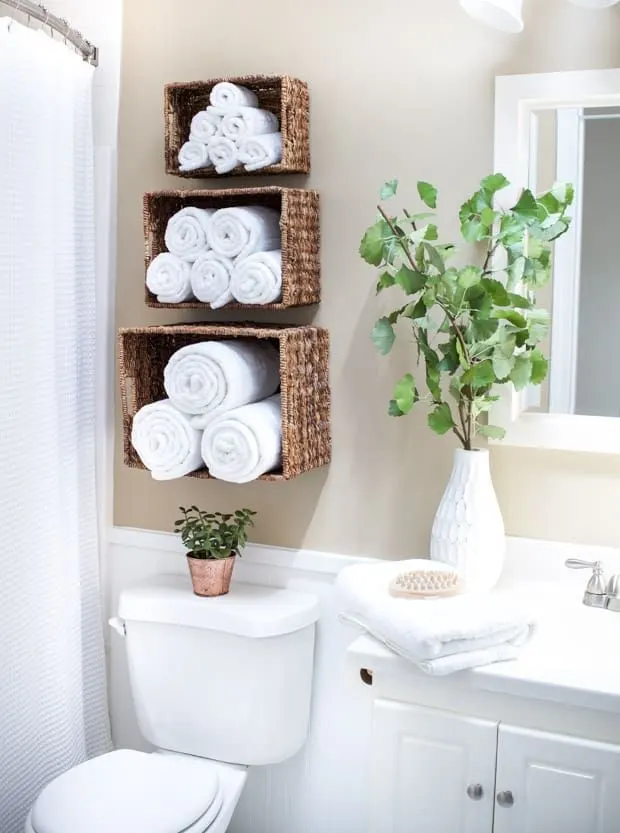 Stacked Plush Towels Above the Toilet