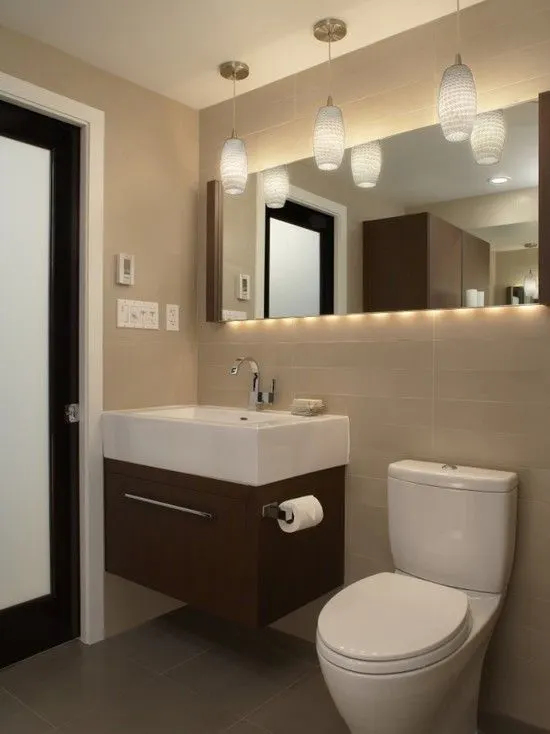 Wide Mirror Installed in a small bathroom