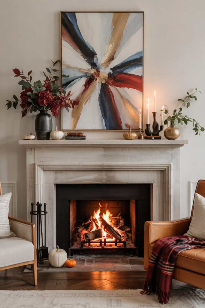 Trendy mantel with burgundy and deep navy accents, plush throws, and rich jewel-toned fall décor.