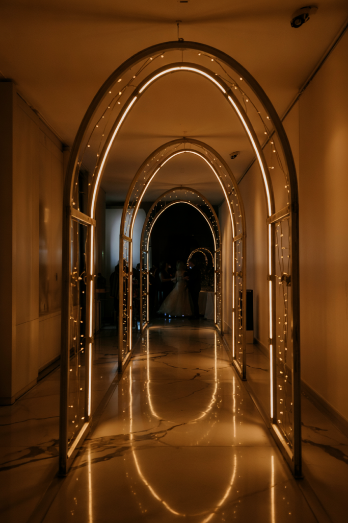 Glowing LED light tunnel entrance creating a magical, festive New Year 2026 gala experience.